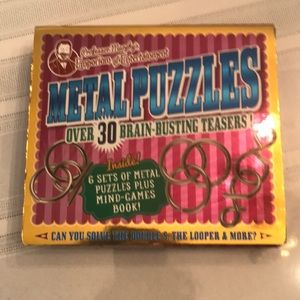 Professor Murphy’s Metal Puzzles with 6 sets of metal puzzles & mind games book.